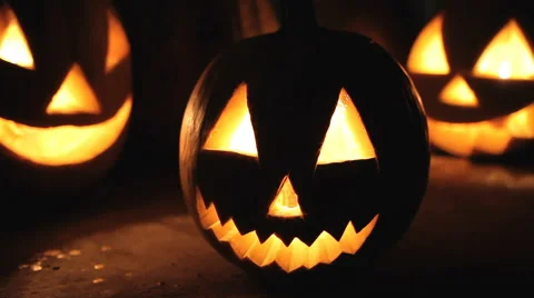 Glowing scary pumpkin at night on the steps 스톡 동영상 68204428
