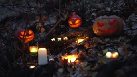 Glowing scary pumpkins, burning candles. Slow motion. Halloween holiday concept. Video stock 139201218