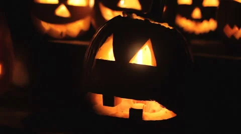 Glowing scary pumpkins at night on the steps 스톡 동영상 68202785