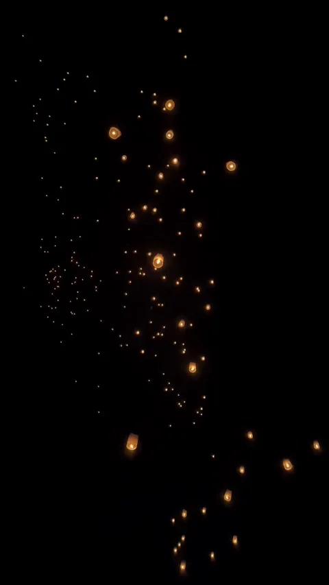 Glowing Sky Lanterns Floating in the Dark Night Sky Vertical Stock Footage 296501423