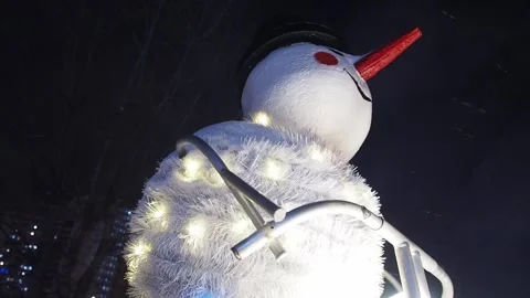 Glowing snowman with falling snow. Stock Footage 257137038