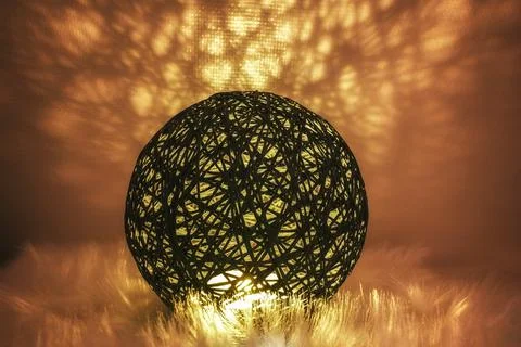 A glowing sphere made of a tissue-like network in an atmospheric environment Stock Photos
