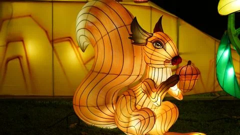 Glowing Squirrel Lantern Illuminates a Festive Night Display Stock Photos