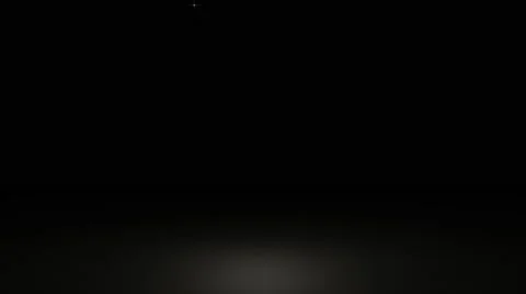 Glowing star particle in random direction with bounce on spotlight ground abs Stock Footage 65937383