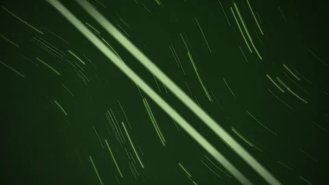 Glowing star trail lines flow diagonally across a monochrome frame Stock Footage 342215754