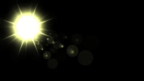 Glowing star with yellow light rays on plain black background Stock Footage 338151177