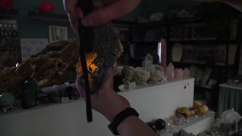 Glowing stone. Opal. The stone glows under ultraviolet light. Geology. Stock Footage 266277298