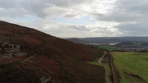 Glowing sunbeams over rural patchwork countryside farmland landscape Stock Footage 141877165