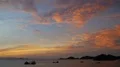 Glowing sunset with boats and cloudy sky at sea coastline over Flores islands 4k or 4k+ Resolution
