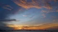 Glowing sunset panorama with cloudy sky at sea coastline over Flores islands 4k or 4k+ Resolution