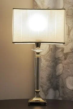 Glowing table lamp in the bedroom Stock Photos