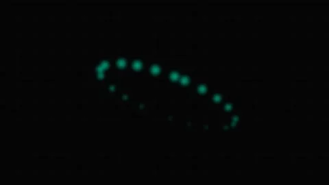Glowing teal dots arranged in an oval pattern against a deep black background Stockbeeldmateriaal 339619396