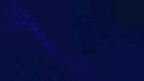 Glowing tiny particles rolling blue screen Stock Footage 259262165