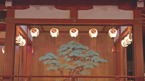 Glowing Tomoe Lanterns Above Painted Pine Tree on Traditional Noh Stage Japan 库存影片 336223137