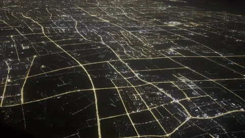 Glowing urban grid of Shanghai at night from a flying plane. Stock Footage 333468340