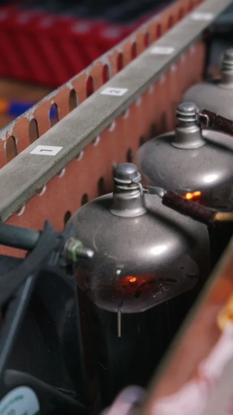 Glowing Vacuum Tube Operating Inside Vintage Homemade Analog Amplifier Stock Footage 334131064