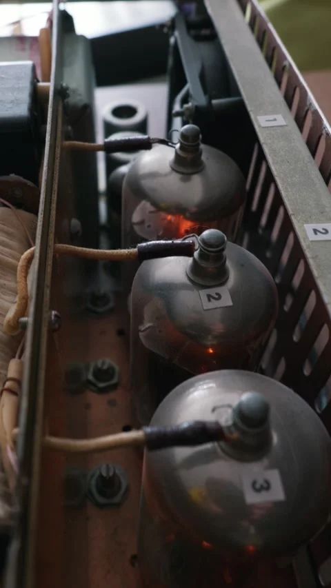 Glowing Vacuum Tubes Operating Inside a Homemade Audio Amplifier Chassis Stock Footage 334130915