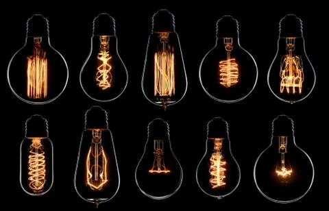 Glowing vintage light bulbs set. Black background Stock Photos