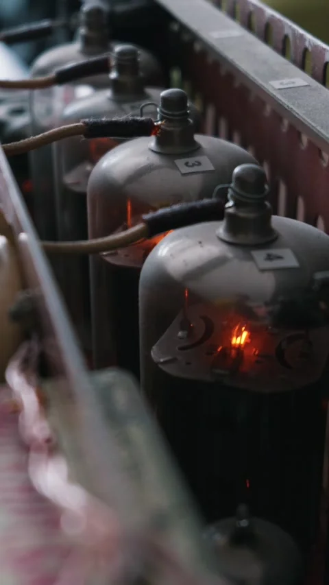 Glowing Vintage Vacuum Tubes Operating in a Custom Audio Amplifier Stock Footage 334130873