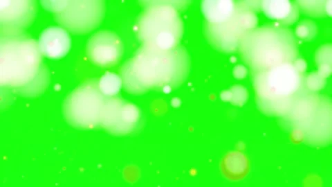 Glowing white bokeh lights on green background Stock Footage 338178734
