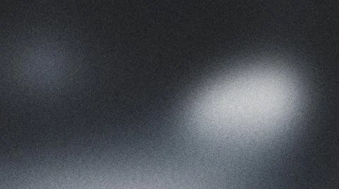 Glowing white light on dark gray textured background with spotlight effect Illustrazione stock