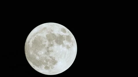 Glowing white moon time lapse in the dark sky in night. Stock-Footage 236926640