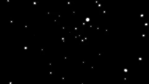 Glowing white particles floating slowly on black background Stockbeeldmateriaal 336933873
