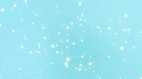 Glowing white snowflakes falling down against a teal blue background Stock Footage 68509790