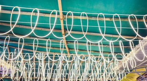 Glowing White String Lights Draped Across Bamboo Canopy Stock Photos