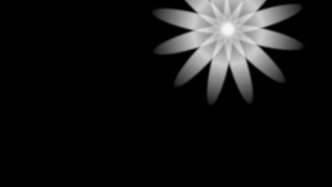 A glowing white symmetrical star pattern isolated against a deep black Video stock 335118359
