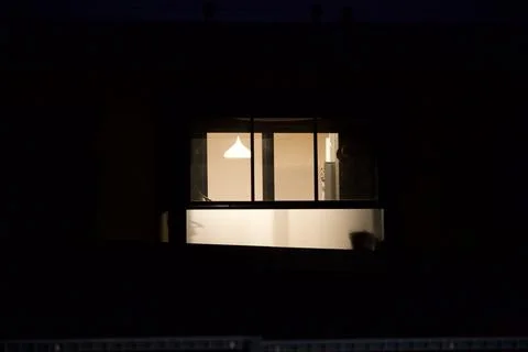 Glowing window at night Stock Photos