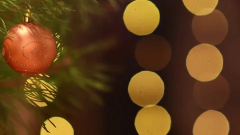 Glowing Winter Holiday Loop with Amber Bauble and Soft Bokeh 스톡 동영상 344405238