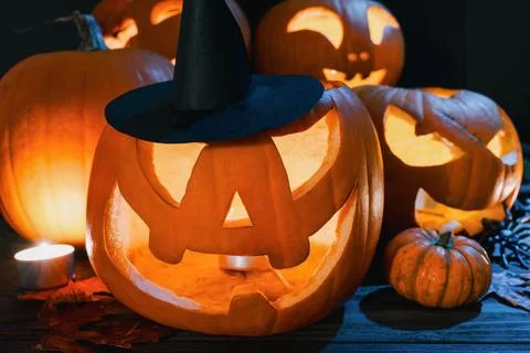 Glowing Witch Jack O Lantern with Halloween Pumpkins Stock Photos