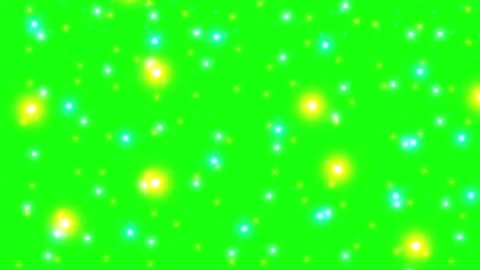 Glowing yellow and blue light particles floating on a vibrant green screen 库存影片 342898574
