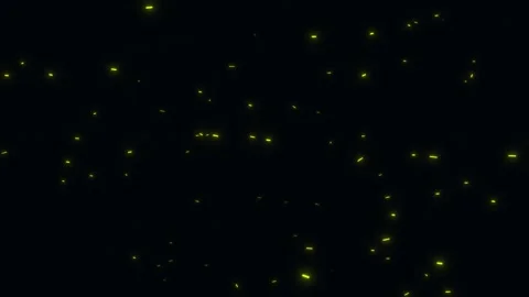 Glowing yellow particles slowly floating up against black background Stock Footage 327511295
