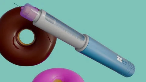 A GLP-1 injection pen and colorful glazed donuts fall and tumble Stock Footage 335975064