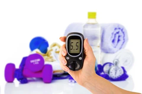 Glucometer for glucose level and healthy organic food on a white background Stockfoto's