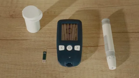 Glucometer reading shows 101 mg dL, near limit for diabetes and prediabetes Stock Footage 334033152
