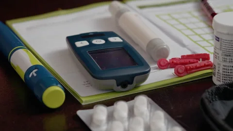 Glucometer setup for daily blood sugar monitoring and record-keeping Video stock 302423573