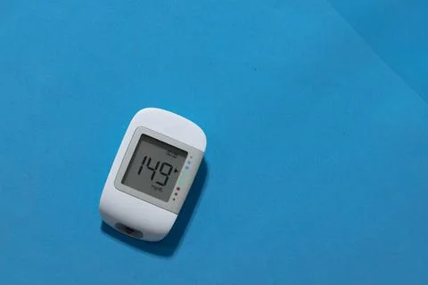 Glucometer showing a bad result in the display, Glucometer isolated Stock Photos