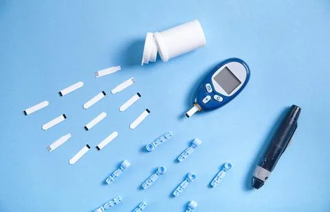 Glucometer with test strips and other objects. Devices for measuring of gluco Stock Photos