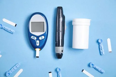 Glucometer with test strips and other objects. Devices for measuring of gluco Stock Photos