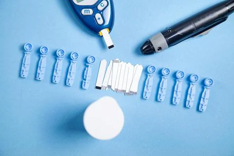 Glucometer with test strips and other objects. Devices for measuring of gluco Stock Photos