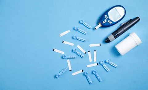 Glucometer with test strips and other objects. Devices for measuring of gluco Stock Photos