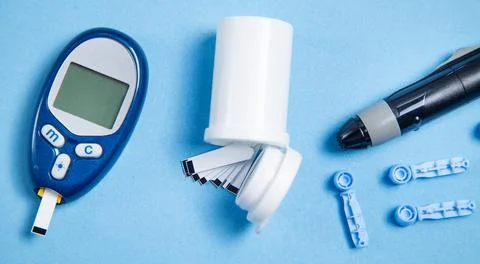 Glucometer with test strips and other objects. Devices for measuring of gluco Stock Photos