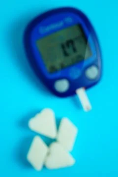 Glucometer with a very low sugar reading. Blur effect. Clouding of consciousness Stock Photos