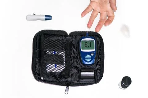 Glucometer woman's hand Stock Photos