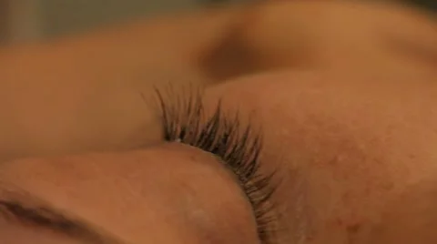 Glue and paint eyelashes Stock Footage 44440473