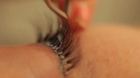 Glue and paint eyelashes Stock Footage 44440585