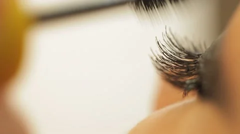 Glue and paint eyelashes Stock Footage 44440808